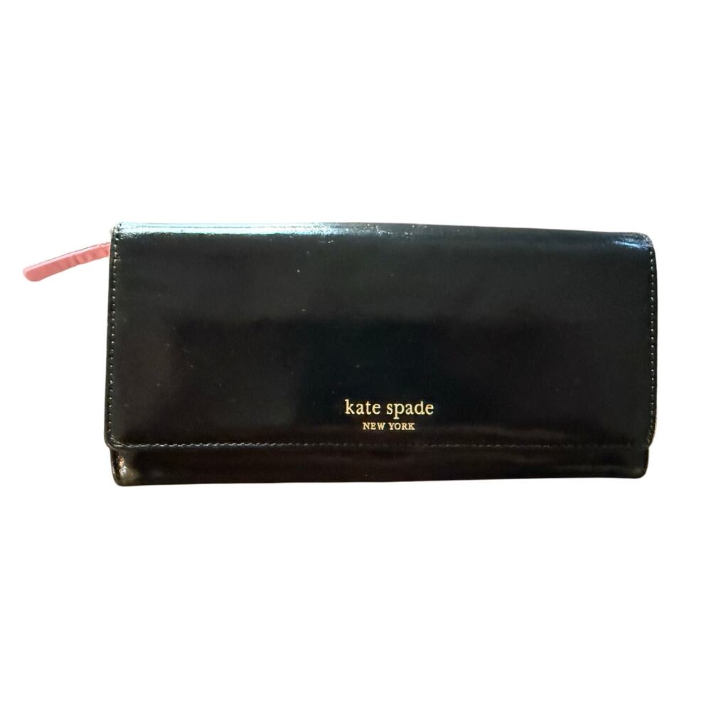 Kate Spade wallet in black leather with pink leather interior.